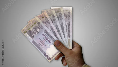 Bangladesh Taka growing pile of money in hand concept 3d illustration photo
