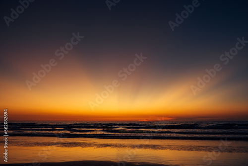 Colorful twilight over the sea. Stunning sunset on the ocean coast. Evening sky.