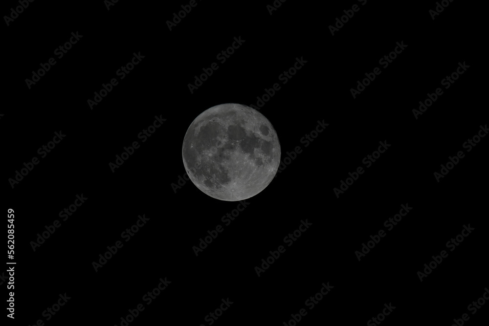 Obraz premium full moon close up on black background