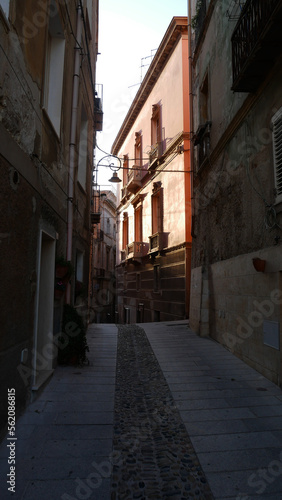 A typical winding and narrow street in Cagliari  Sardinia.  Brightly painted houses.