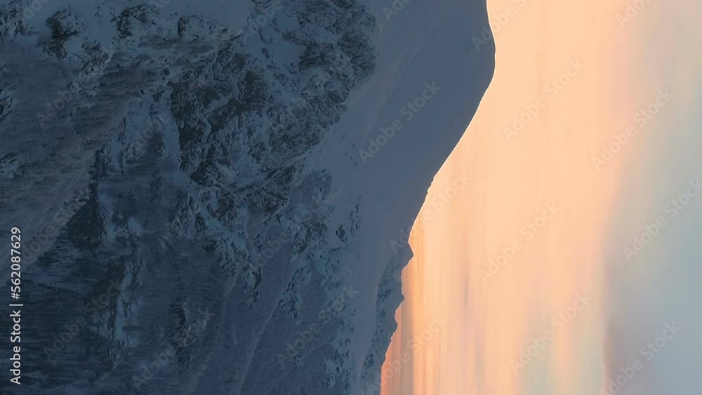 Winter sunset over foggy mountains at Botev peak, Bulgaria in vertical video Winter sunset over foggy mountains at Botev peak, Bulgaria in vertical video