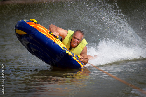 Man tubing on river