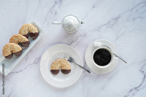 Fotografie 4 Almont crescent with chocolate icing, espresso cannikin and a cup of espresso