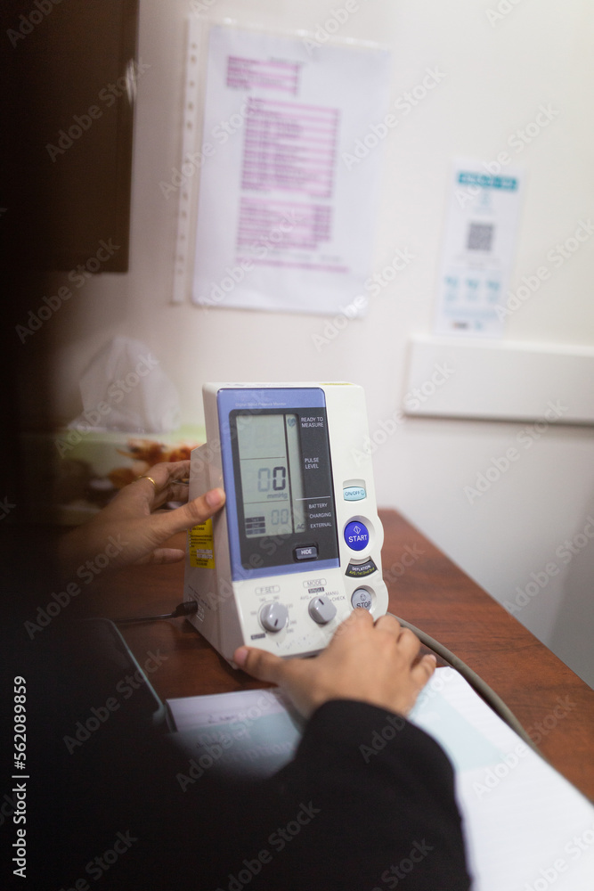 closeup shot of a an automatic monitor used for checking blood pressure closeup shot of a an automatic monitor used for checking blood pressure