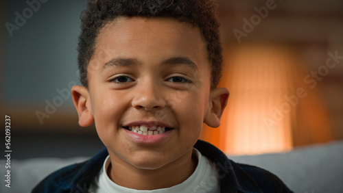 Close up head shot portrait indoors child boy ethnic male kid African American smiling happy little small son schoolboy preschooler smile toothy children dental healthcare pediatric custody service