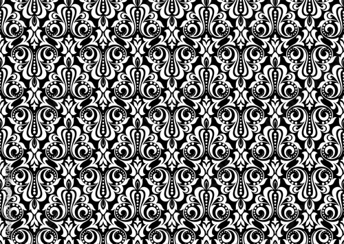 Wallpaper in the style of Baroque. Seamless vector background. White and black floral ornament. Graphic pattern for fabric, wallpaper, packaging. Ornate Damask flower ornament