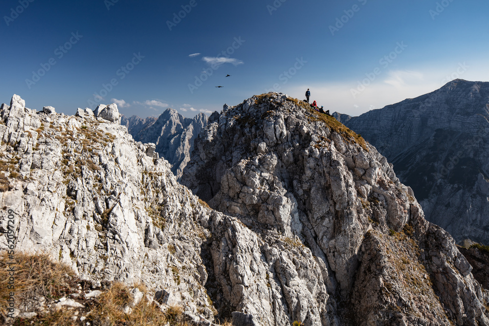 Hikers enjoying a beautiful autumn day at Loibler Baba on the carinthian Slovenian border in the Koschutta massive