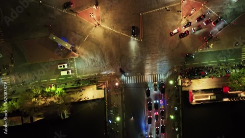 Birdseye view of police chase on their motorcycles at night in Paris, France photo
