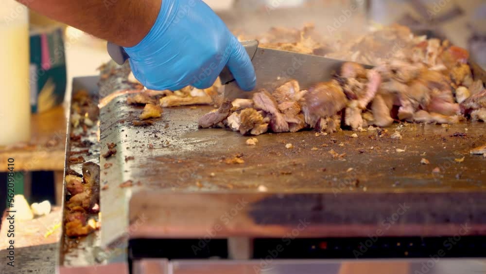 Chef cooking, cutting and seasoning meat on kebab restaurant Chef cooking, cutting and seasoning meat on kebab restaurant