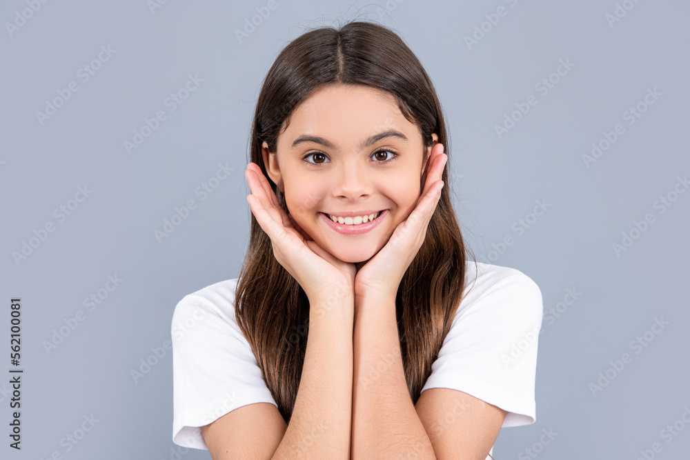 portrait of teen girl with long hair wearing tshirt. teen girl isolated on grey. teen girl portrait of teen girl with long hair wearing tshirt. teen girl isolated on grey. teen girl