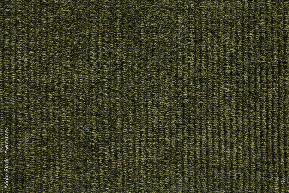 Green corduroy fabric texture as background Green corduroy fabric texture as background
