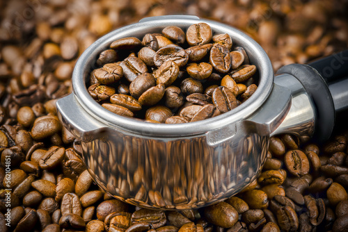 Wallpaper Mural Porta filter with coffee beans on the background of more beans. Close up and Macro Torontodigital.ca