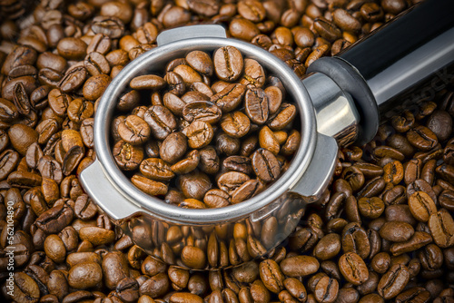 Wallpaper Mural Porta filter with coffee beans on the background of more beans. Close up and Macro Torontodigital.ca