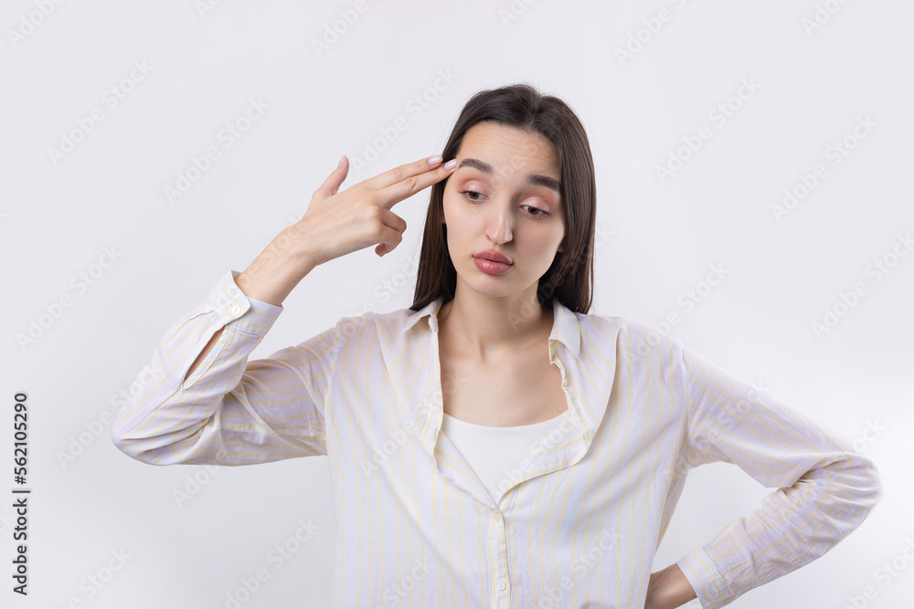 Young beautiful woman with facial expression of surprise standing over white background. Young beautiful woman with facial expression of surprise standing over white background.