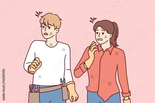 Frightened man with repair tools and woman in dirty clothes looking away. Guy and girl in rubber gloves with discouraged face after making mistake while repairing their own hands. Flat vector image