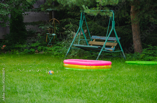 on the lawn swings and inflatable pool