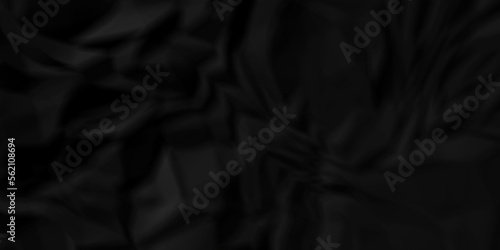 Dark Black facbric paper backdrop crumpled texture. dark black textured crumpled black paper background. panorama black paper texture background, crumpled pattern.