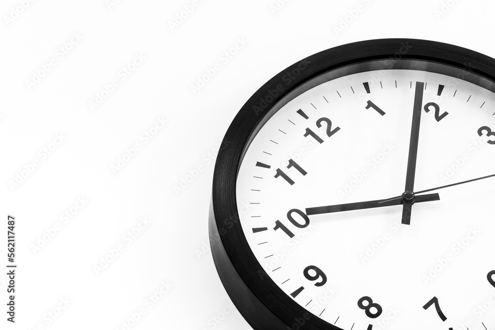 Round wall black and white clock. Time to work or rest concept Round wall black and white clock. Time to work or rest concept