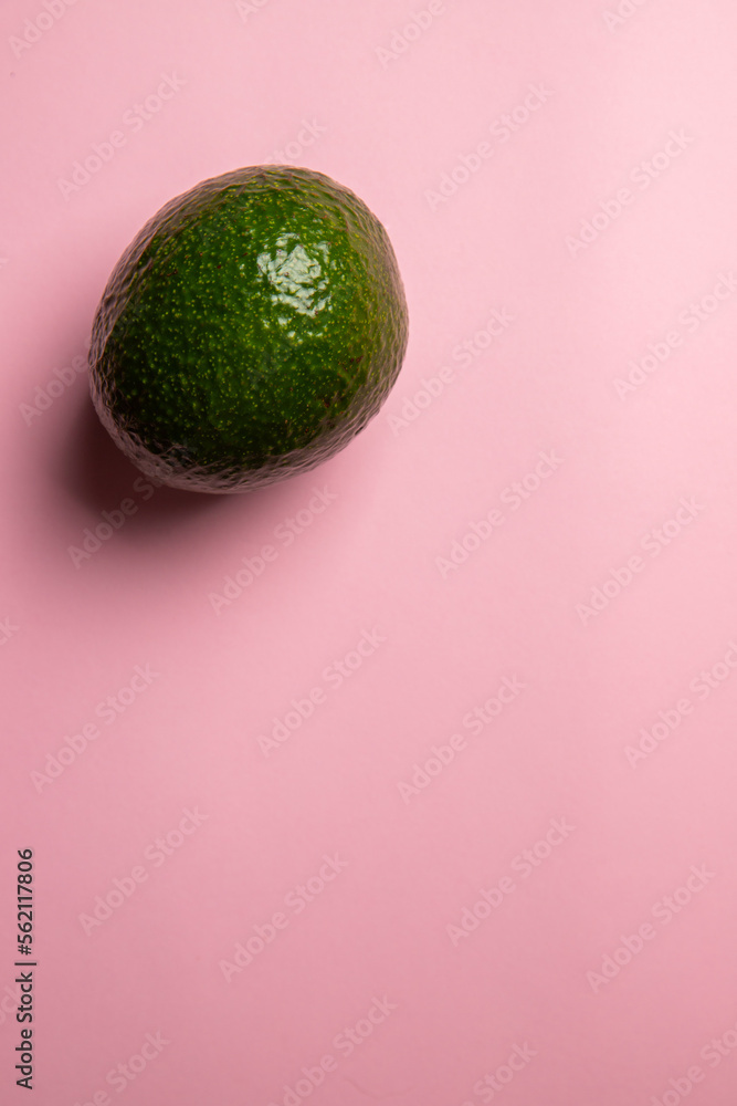 The top view of eco exotic avocado on the pink background The top view of eco exotic avocado on the pink background