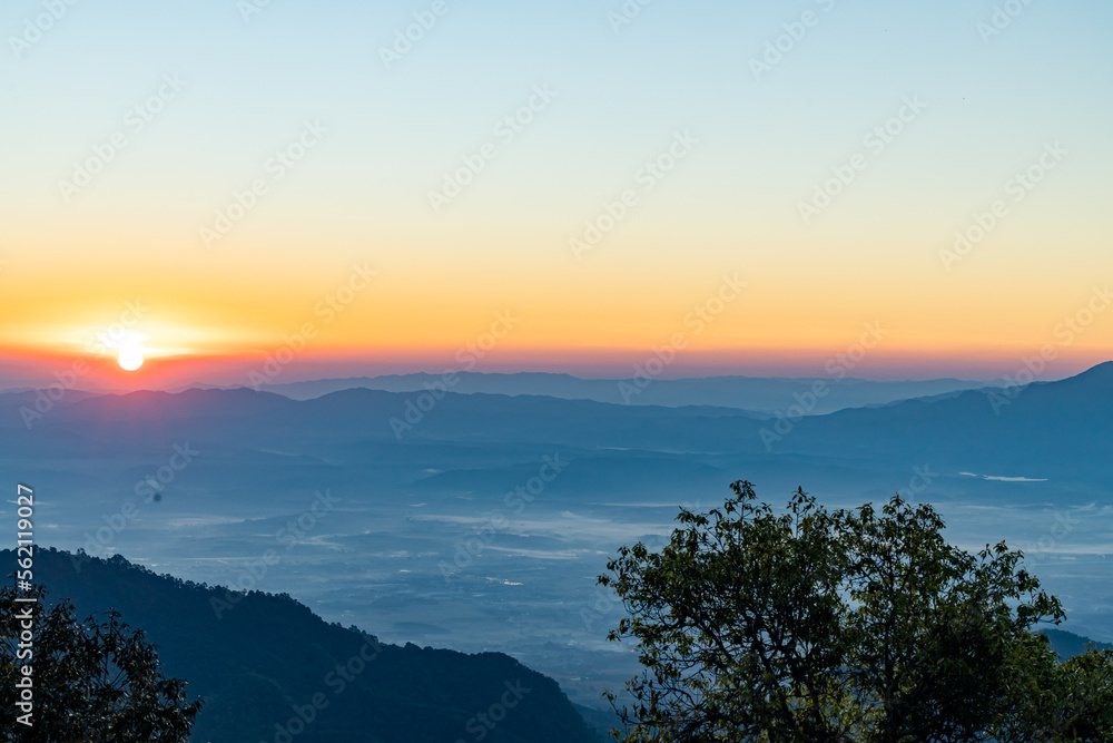 View of  Beautiful landscape in the mountains at sunrise in the morning. Beautiful sky background and the foggy hills covered. Nature tourism, healthy lifestyle concept and beautiful nature.