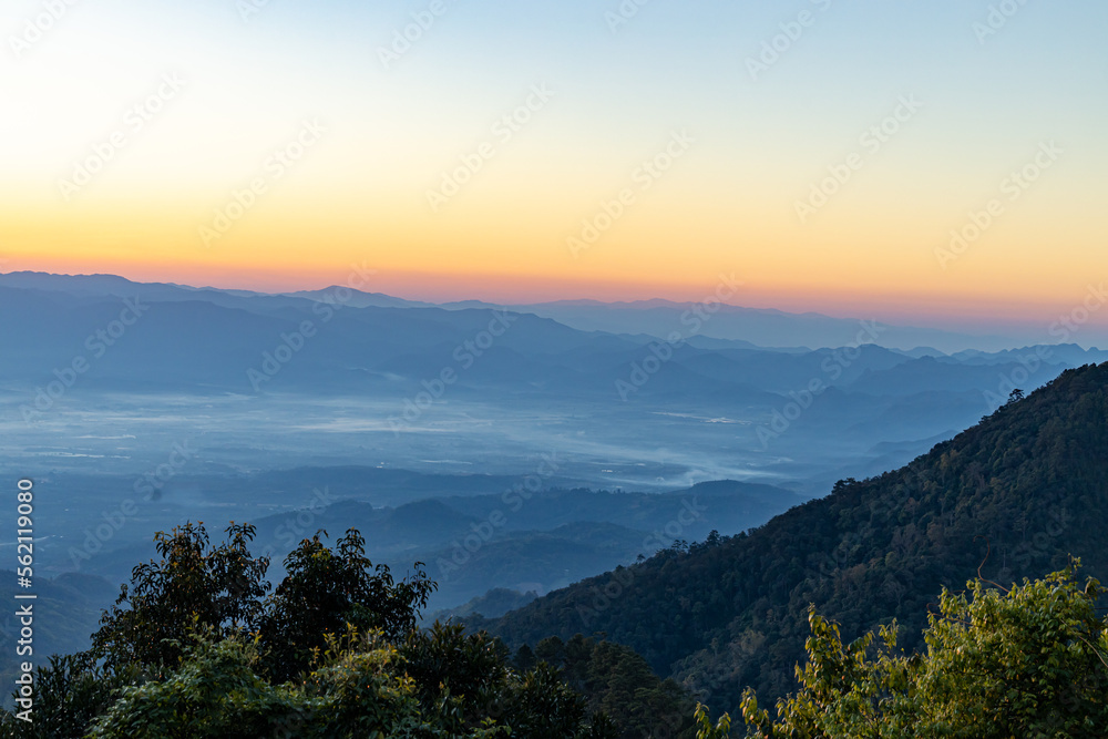View of  Beautiful landscape in the mountains at sunrise in the morning. Beautiful sky background and the foggy hills covered. Nature tourism, healthy lifestyle concept and beautiful nature.