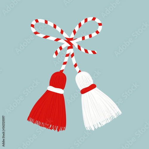 Martisor talisman isolated on blue background. Traditional accessory for holiday of early spring in Romania and Moldova. Red and White spring symbol.