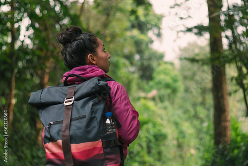woman with backpack walking in the middle of the forest, person hiking in colombia, activity, adventure, alone, backpack, beautiful, child, forest, forest background, freedom, happiness, healthy, hike