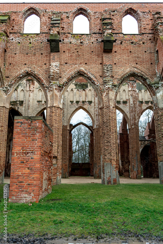 View of the ruins of Tartu Cathedral. This is the main point of interest in Tartu. Arched doors of huge gothic Dome Church in Tartu.