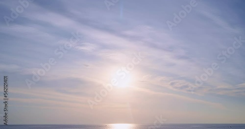 Time lapse of Majestic sunset light over sea landscape,Amazing light of nature cloudscape sky and Clouds moving away rolling, Colorful sunset or sunrise light dramatic clouds in golden hour Footage