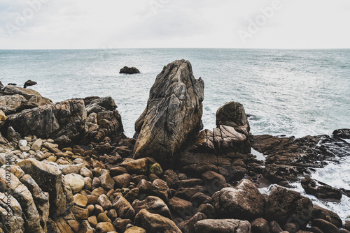 Beautiful and wild rocky coast of France in vintage retro tones, vintage landscape of coastline of France..