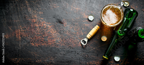 Glass of beer and a bottle.