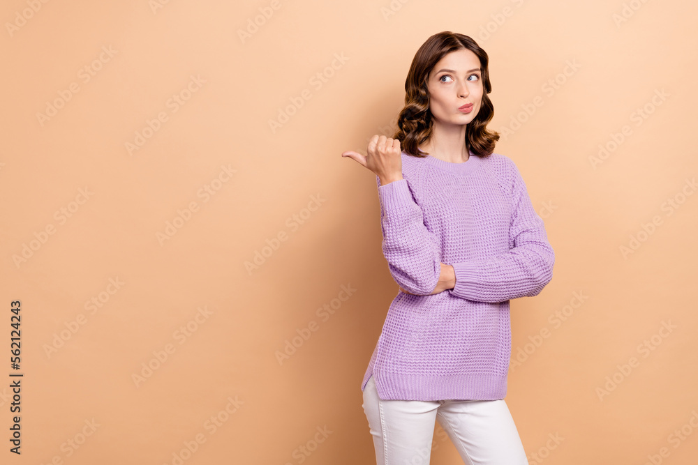 Obraz premium Photo of minded lady wear purple stylish clothes suspicious look empty space offer thinking buy or not isolated on beige color background