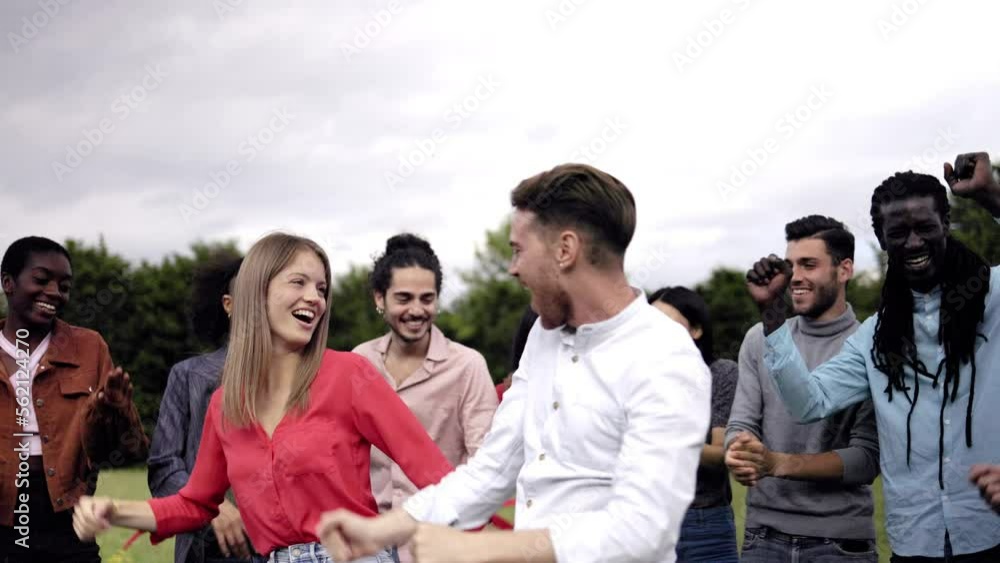 Happy multiracial group of friends having fun outdoor in city park Happy multiracial group of friends having fun outdoor in city park