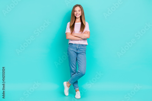 Full length photo of shiny confident lady wear striped t-shirt arms folded isolated turquoise color background