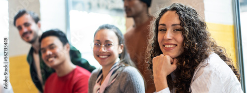 Horizontal banner or header with university students multiethnic team studying together on a new project in creative coworking classroom - Bright filter with focus on first woman on left