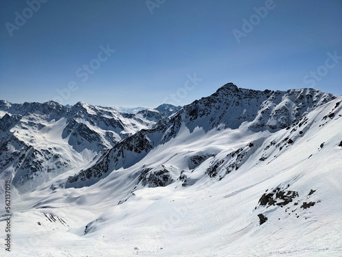 Mountain panorama on the Pischahorn above Davos Mountains. Beautiful mountain landscape with snowy mountain peaks © SimonMichael