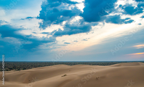 Bright blue cloudy sky over the yellow desert of Kyzylkum Kazakhstan