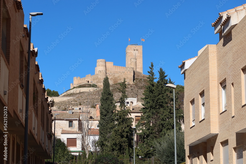 Biar, Alicante, Spain, January 14, 2023: View of the Arab Castle of Almohad origin from the 12th century from a street in Biar, Alicante, Spain