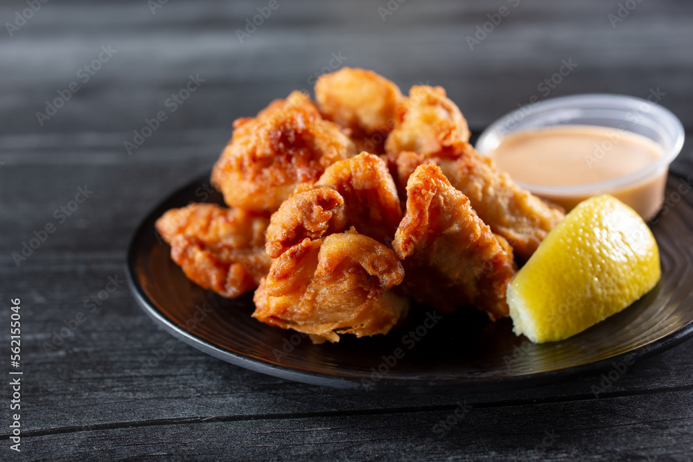 A view of an appetizer plate of Japanese fried chicken, or chicken karaage. A view of an appetizer plate of Japanese fried chicken, or chicken karaage.