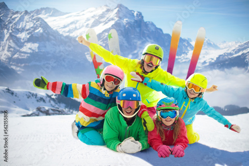 Family in winter mountains. Ski and snow vacation.