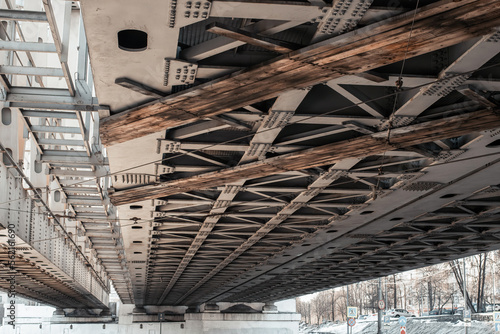 metal construction under bridge steel beam with iron screw and rivets