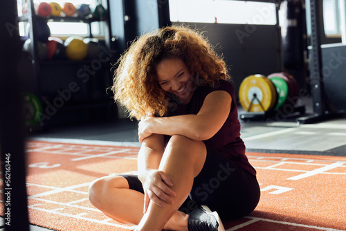 Woman laughing after a gym workout photo