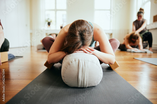 Woman practicing the supported butterfly pose