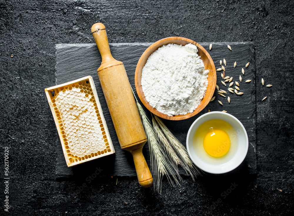 Fototapeta premium Flour, honey, egg and spikelets.