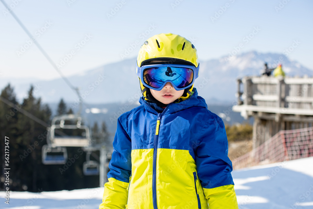 Happy family, skiing in Italy on a sunny day, kids and adults skiing together Happy family, skiing in Italy on a sunny day, kids and adults skiing together