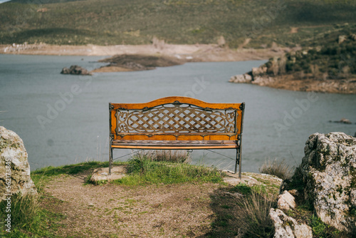 Empty vintage bench by the Ricobayo reservoir, in Zamora , Spain photo