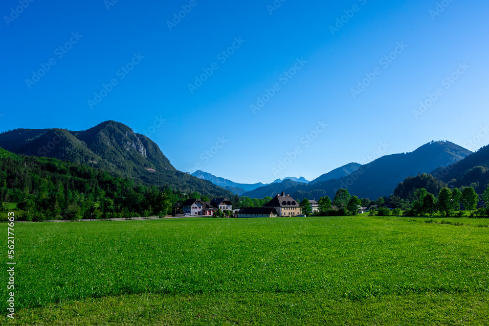 Panoramic view of beautiful mountain landscape, green Austrian village in the Alps, Mountains surrounding the Austrian village