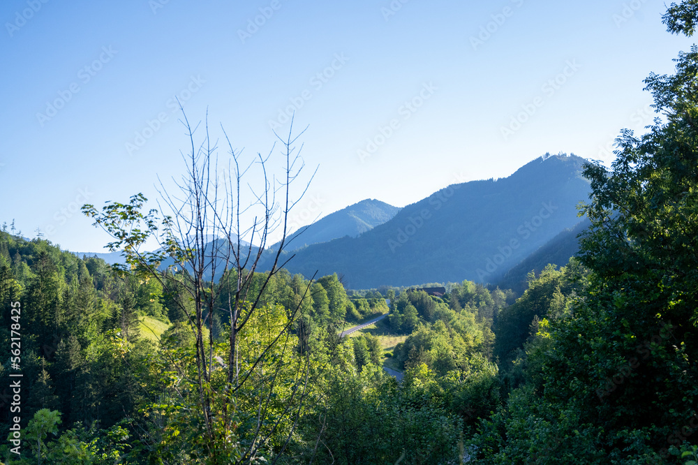 Obraz premium Panoramic view of beautiful mountain landscape, green Austrian village in the Alps, Mountains surrounding the Austrian village