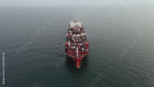 Air view of huge Container ship during underway inn open ocean. Vessel underway.