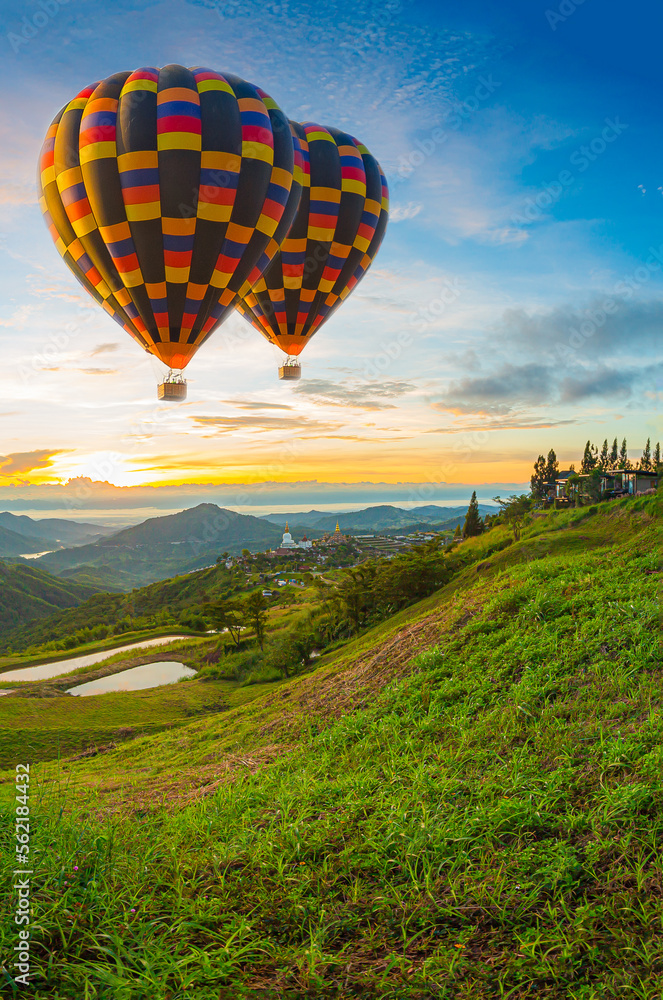 Obraz premium Mountain scenery and balloons in the morning,Balloon and mountain,Hot air balloons with landscape mountain,Colorful hot air balloon ,Hot Air Balloons Flying at Sunset, Cappadocia, Turkey.